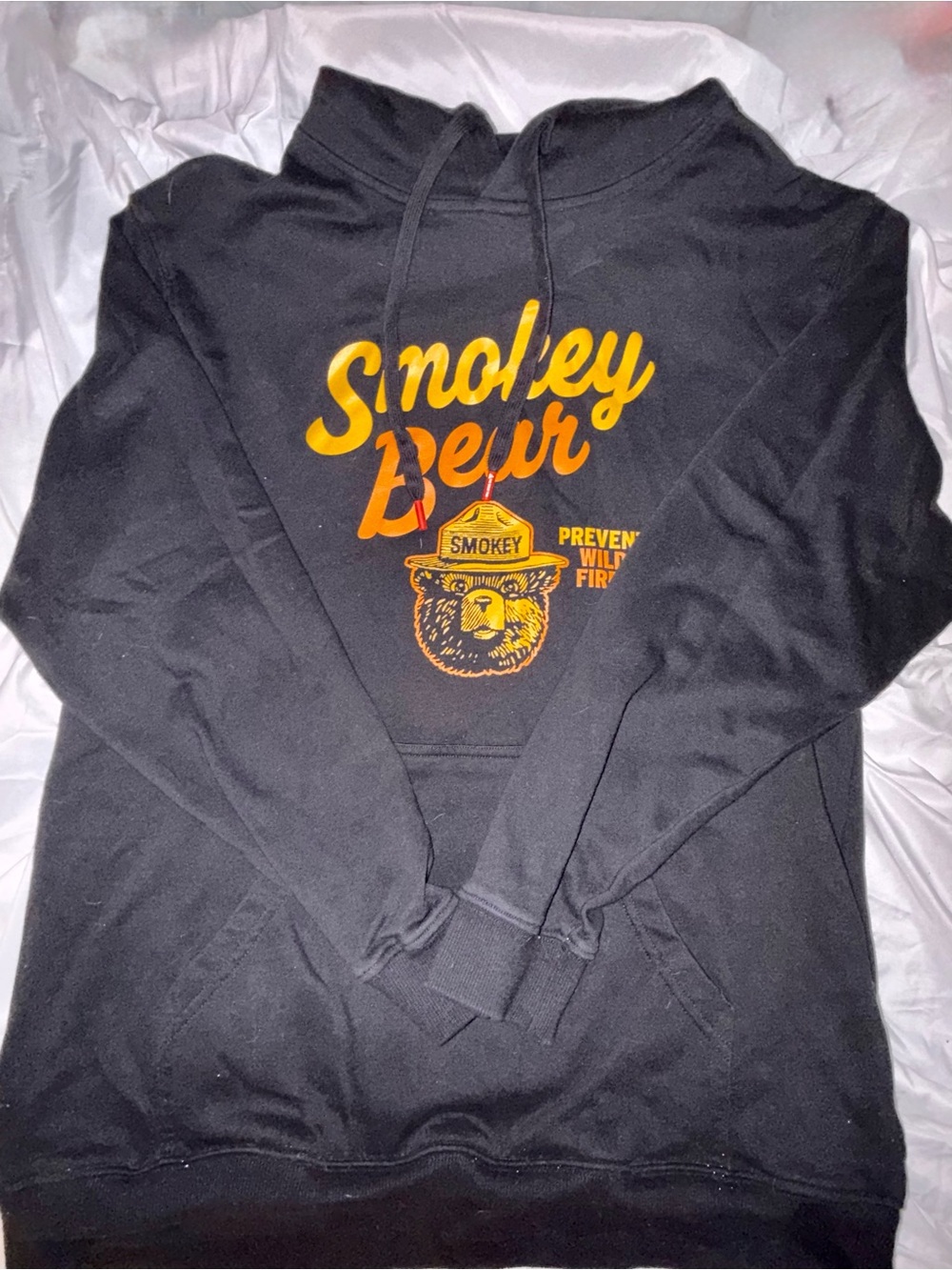 THE GREAT PACIFIC NORTHWEST Black Hoodie with Orange Smokey Bear Graphic